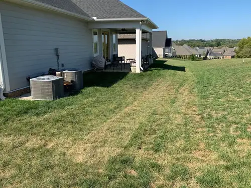 Home and backyard before patio installation.