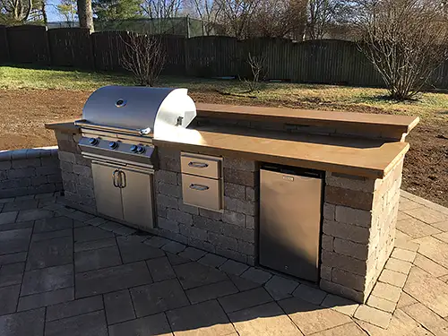 Outdoor grill on paver deck