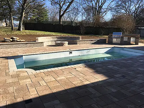 Paver patio, pool deck, outdoor firepit and seating walls and grill