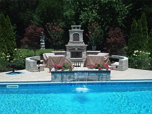 A beautiful outdoor waterwall and fireplace